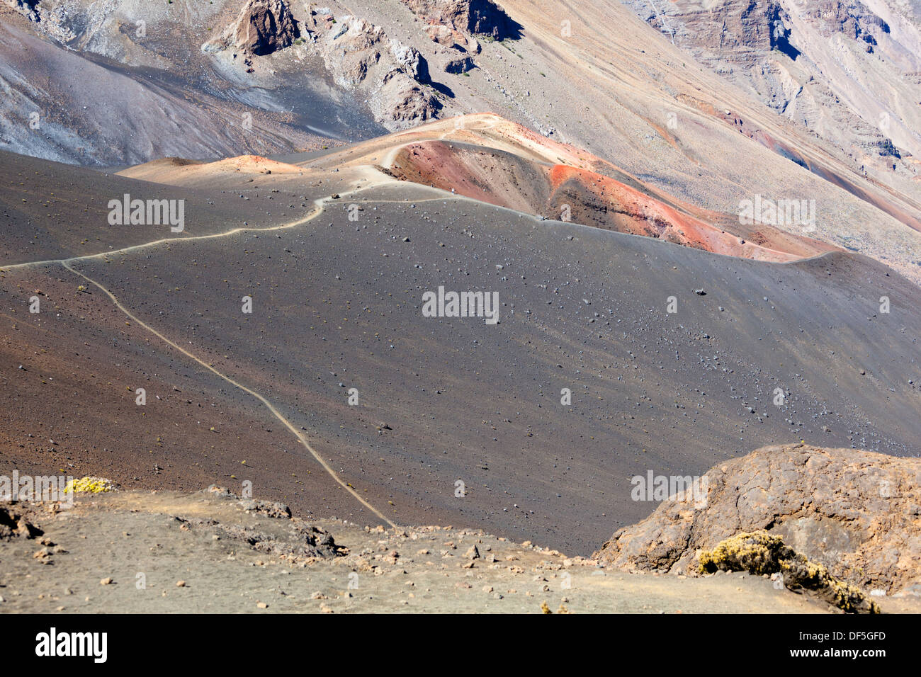 A cinder cone and trails inside the large Haleakala crater in Maui, Hawaii. Stock Photo