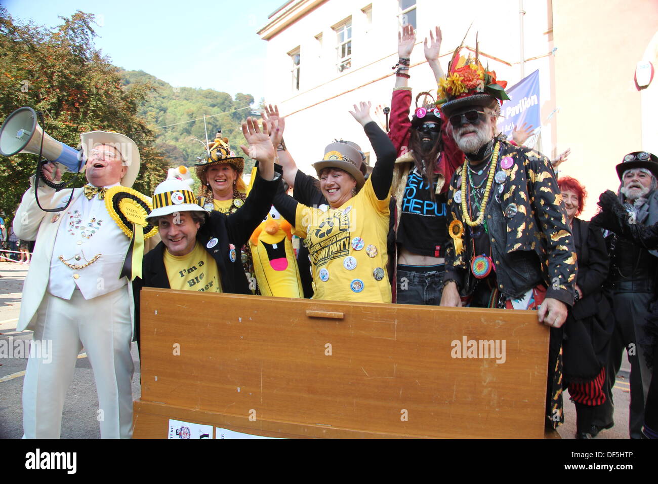 Derbyshire, UK. 28 Sept 2013. Party leader, Alan 'Howlin' Laud' Hope leads the cabinet re-shuffle of The Official Monster Raving Loony Party held at The Grand Pavilion in Matlock Bath, Derbyshire. The conference was held alongside the second annual Steampunk Illuminati event. Party members, steampunks and members of the Black Pig Border Morris dancers took part in the re-shuffle. Credit:  Deborah Vernon/Alamy Live News Stock Photo