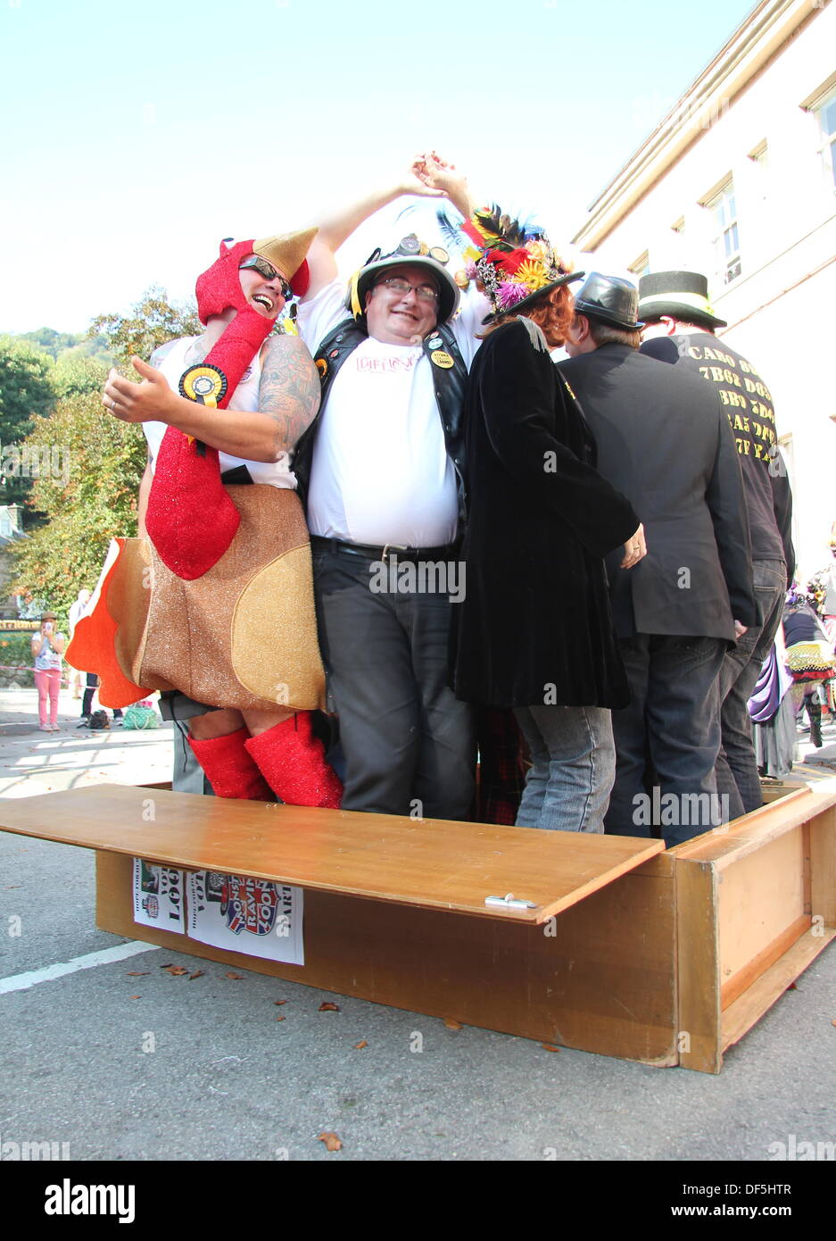 Derbyshire, UK. 28 Sept 2013. The Official Monster Raving Loony Party holds its traditional cabinet re-shuffle where party members and supporters climb inside a wooden cabinet and shuffle. The party conference was held alongside the second annual Steampunk Illuminati event at The Grand Pavilion in Matlock Bath, Derbyshire. Credit:  Deborah Vernon/Alamy Live News Stock Photo