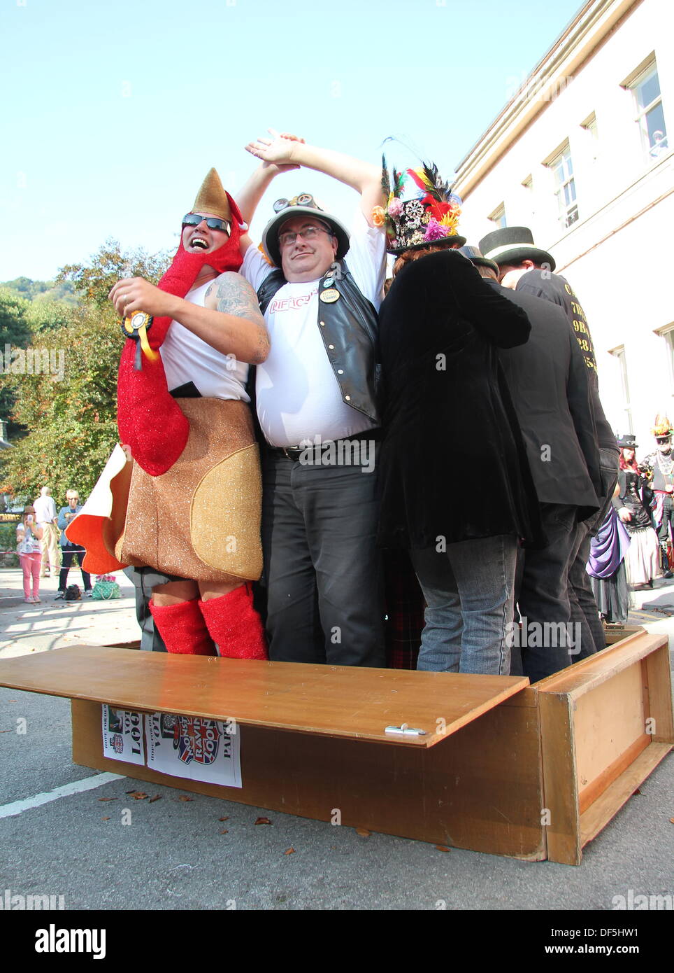 Derbyshire, UK. 28 Sept 2013. The Official Monster Raving Loony Party holds its traditional cabinet re-shuffle where party members and supporters climb inside a wooden cabinet and shuffle. The party conference was held alongside the second annual Steampunk Illuminati event at The Grand Pavilion in Matlock Bath, Derbyshire. Credit:  Deborah Vernon/Alamy Live News Stock Photo