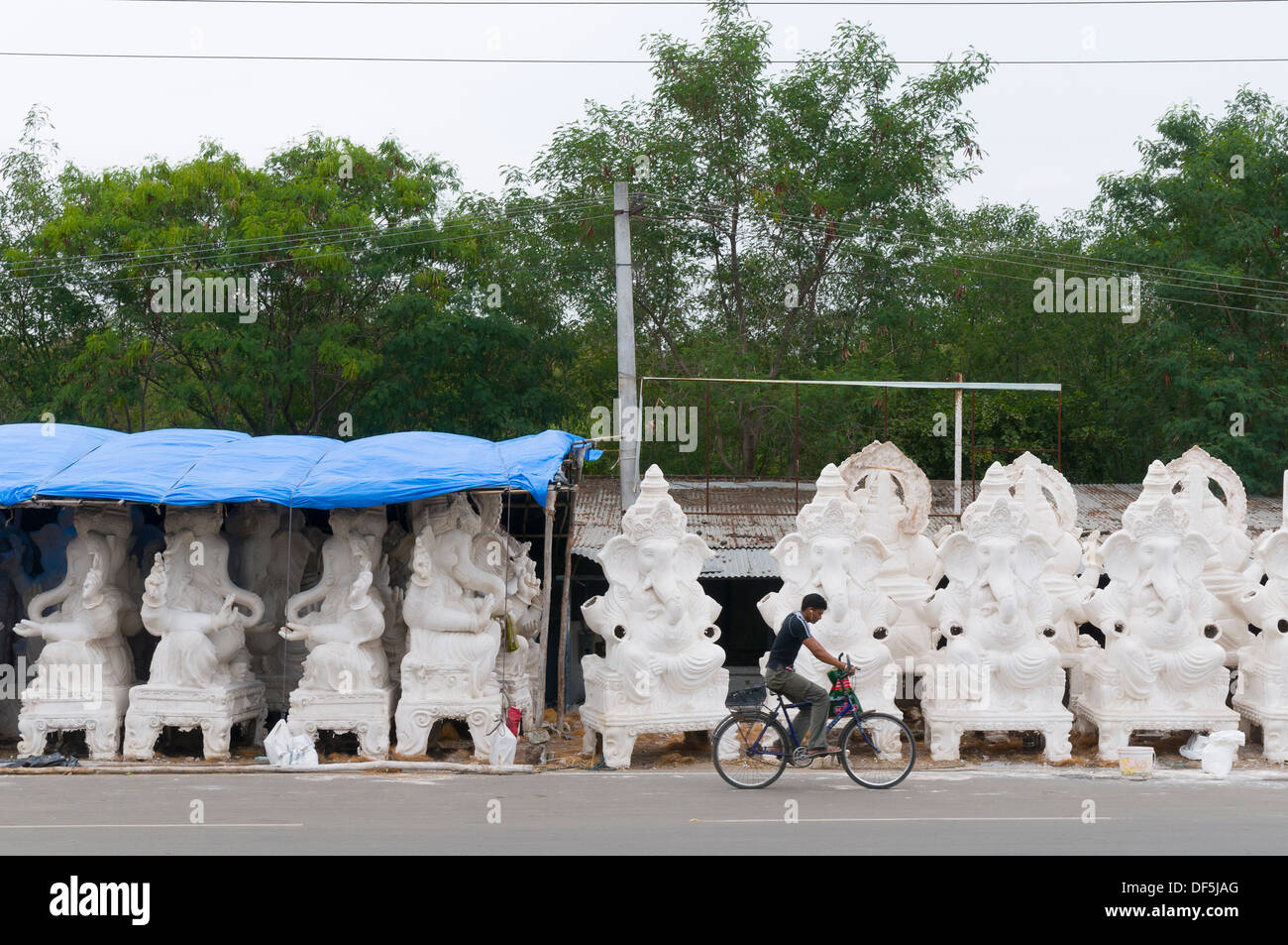 Workers in India making idols in makeshift factories on the side of the street for the Birthday of Lord Ganesha. Stock Photo