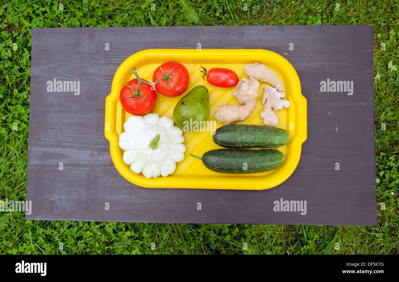 Download Yellow Plastic Tray With Summer Vegetables And Fruits On Black Wooden Stock Photo Alamy Yellowimages Mockups