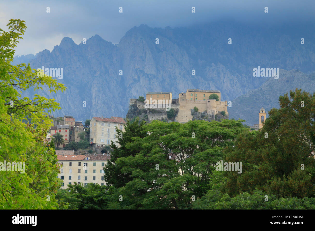 Panoramic view of the citadel and the city of Corte with mountains in the background in North Corsica Stock Photo