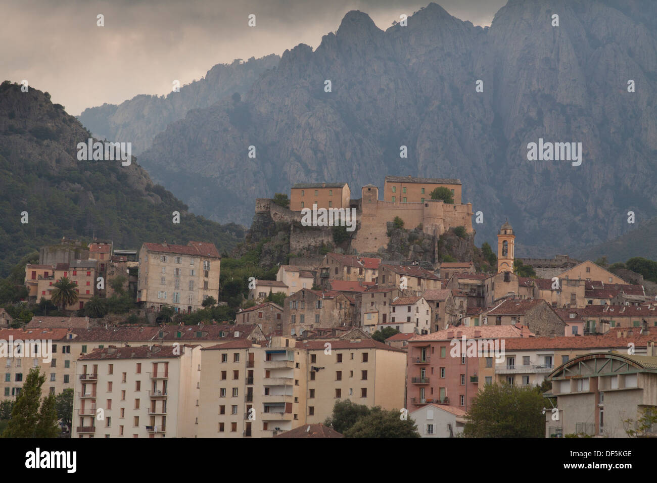 Panoramic view of the citadel and the city of Corte with mountains in the background in North Corsica Stock Photo
