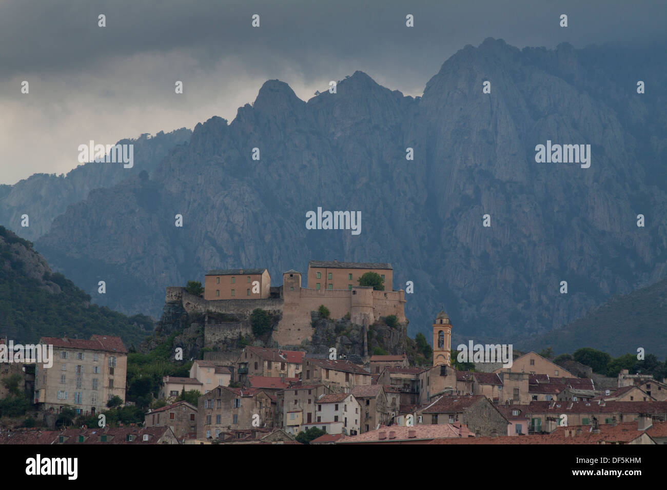 Panoramic view of the Citadel and the city of Corte with mountains in the background in North Corsica Stock Photo