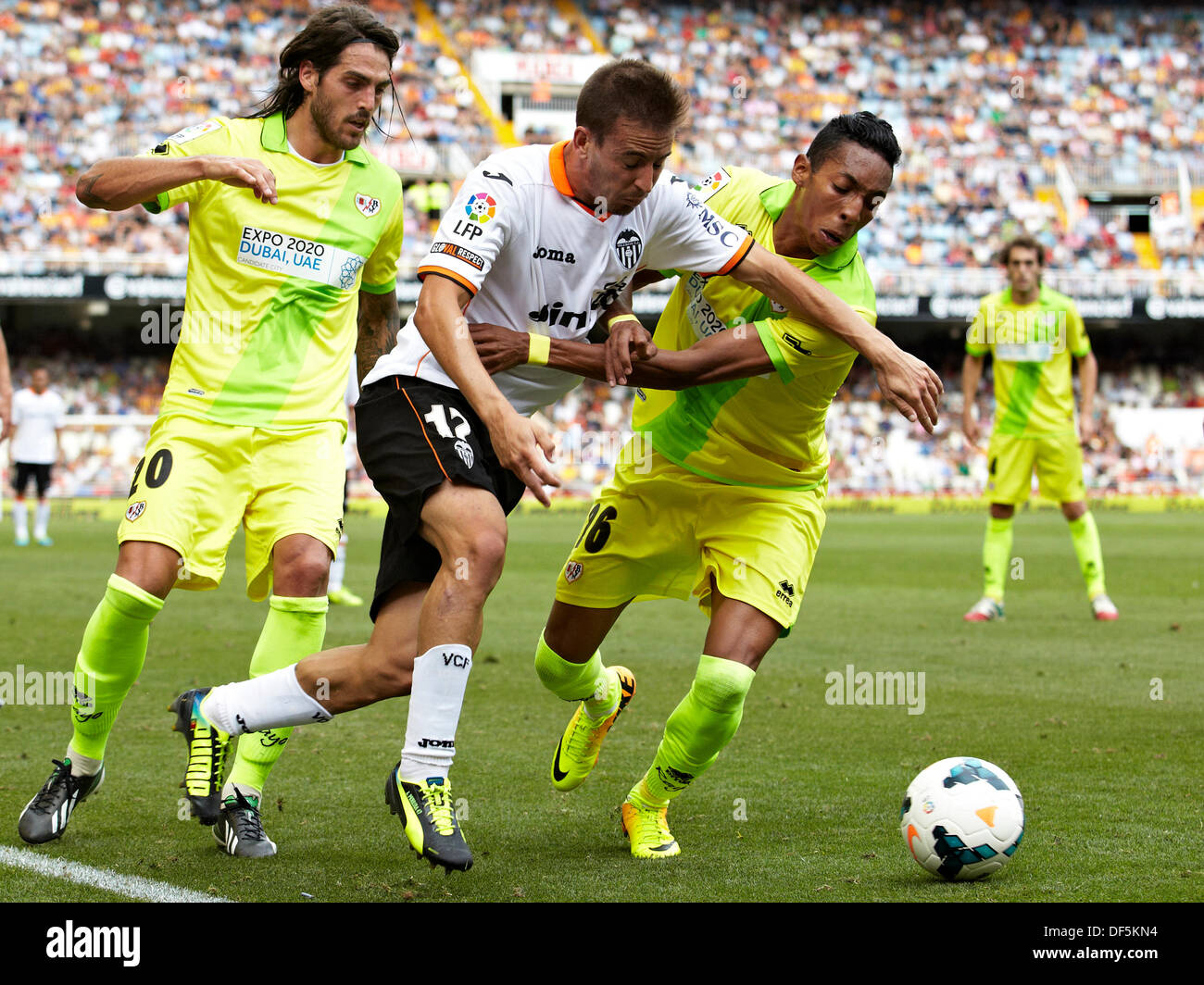 Valencia, Spain. 28th Sep, 2013. Defender Joao Pereira of Valencia CF (C) is challenged by Forward Joaquin Larrivey of Rayo Vallecano (L) and Defender Johan Mojica of Rayo Vallecano during the La Liga Game between Valencia and Rayo Vallecano at Mestalla Stadium, Valencia Credit:  Action Plus Sports/Alamy Live News Stock Photo