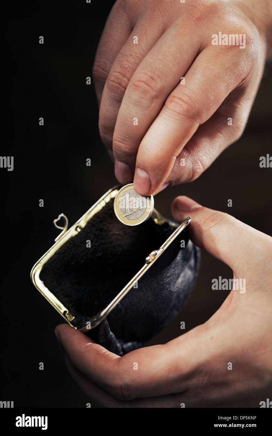 Man taking the last Euro coin from his small change purse. Very short ...