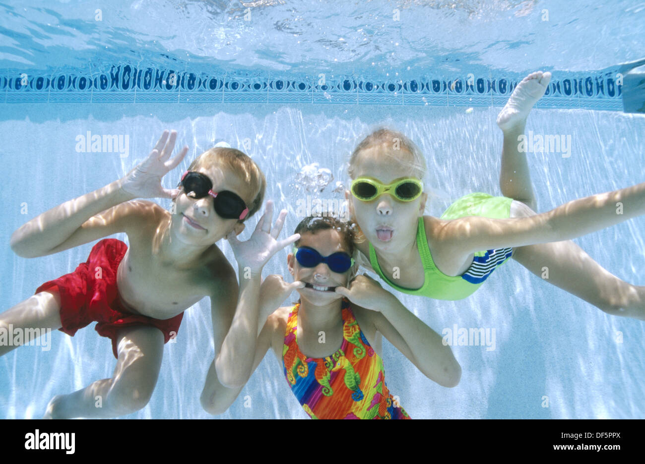kids making funny faces underwater Stock Photo Alamy