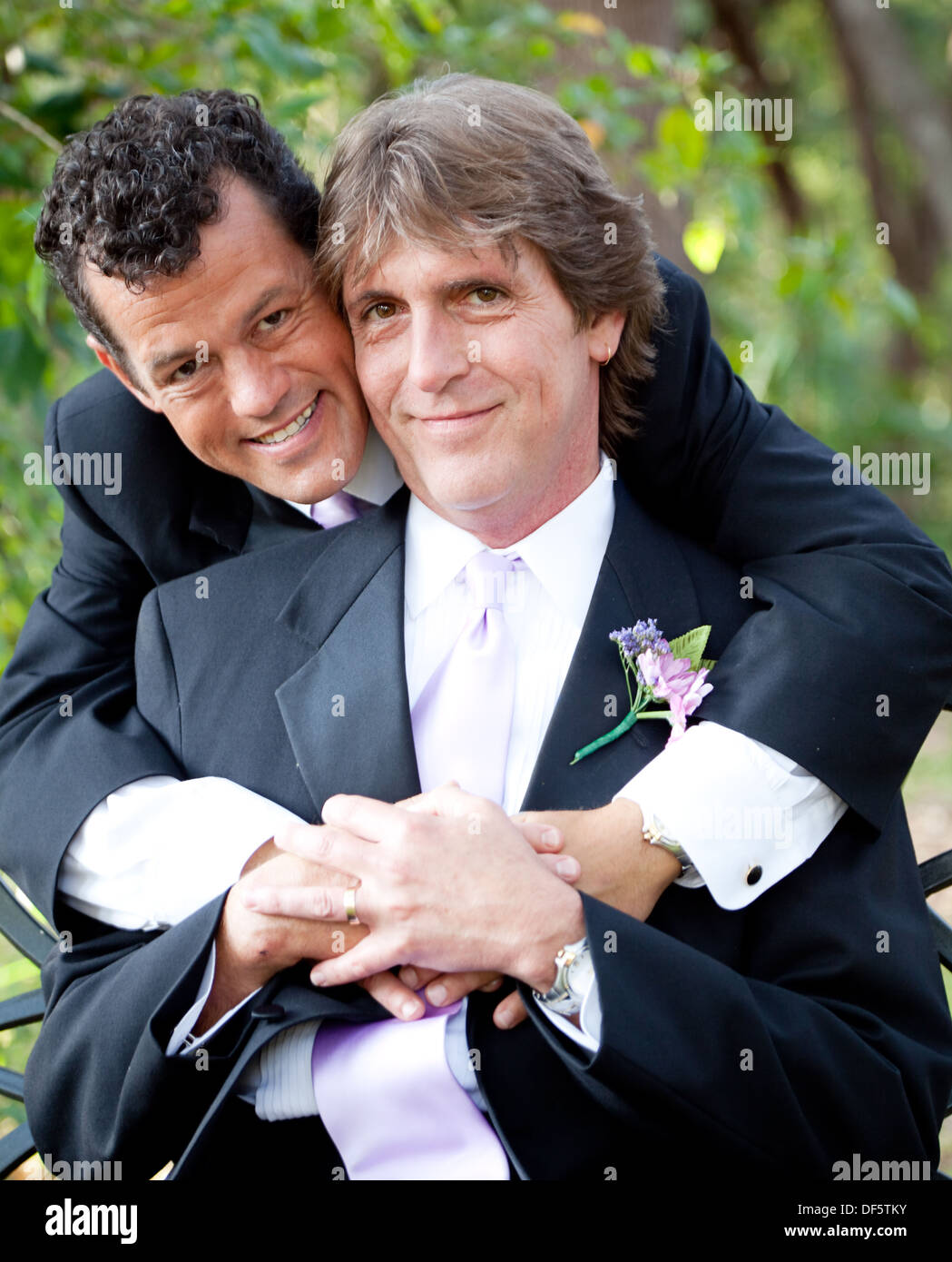 Portrait of a handsome gay couple in their wedding tuxedos.  Stock Photo