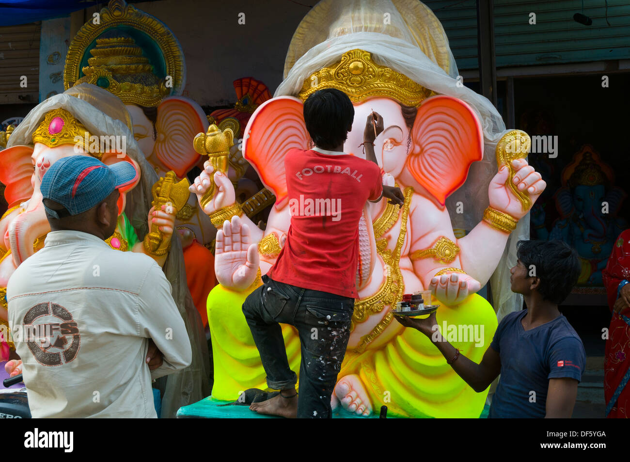 Ganesh idols adorned with flowers and on display for sale on the occasion of Ganesh Chaturthi. The Birthday of Lord Ganesha. Stock Photo