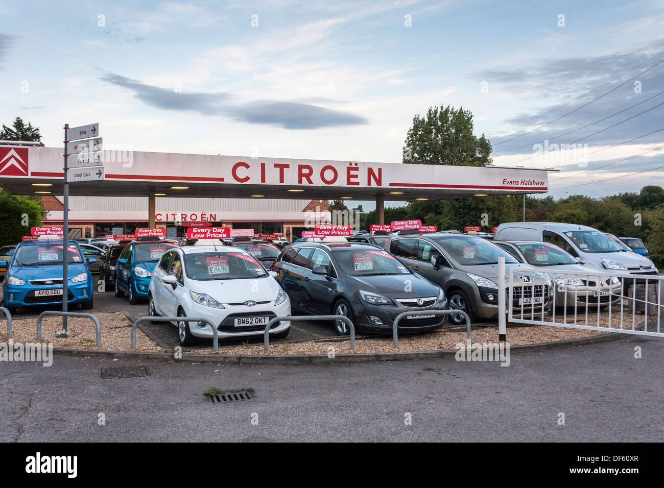 Used cars for sale in a parking lot at a car dealers business Stock Photo