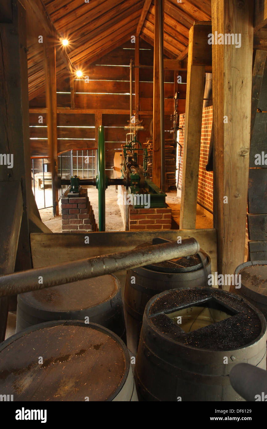 Oil barrels and the Drilling Steam Engine. Drake Oil Well Museum. East Titusville, Titusville, Pennsylvania, United States. Stock Photo