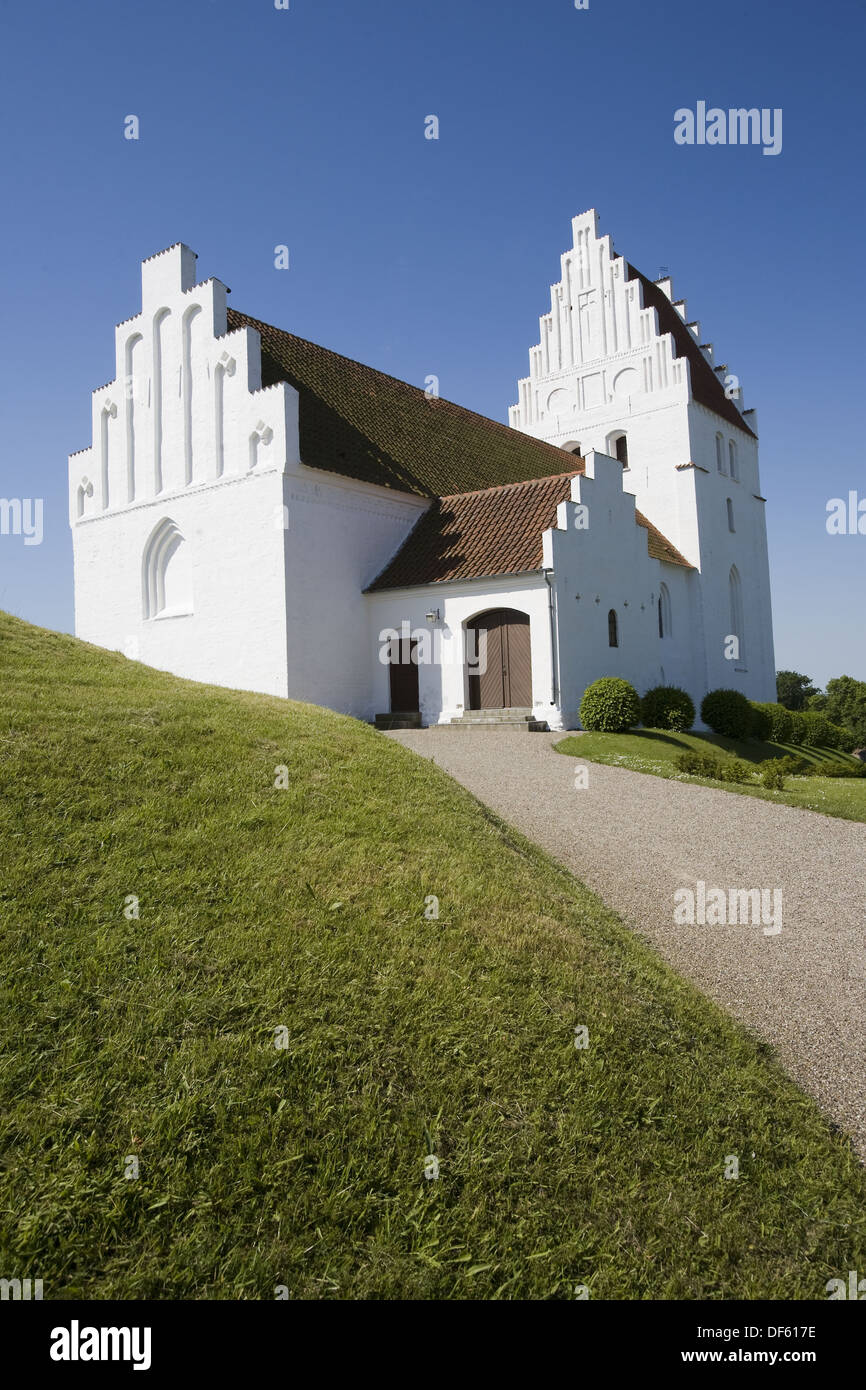 Kirkegardsudvalged church with burial mound. Hijertebjerg. Denmark Stock Photo