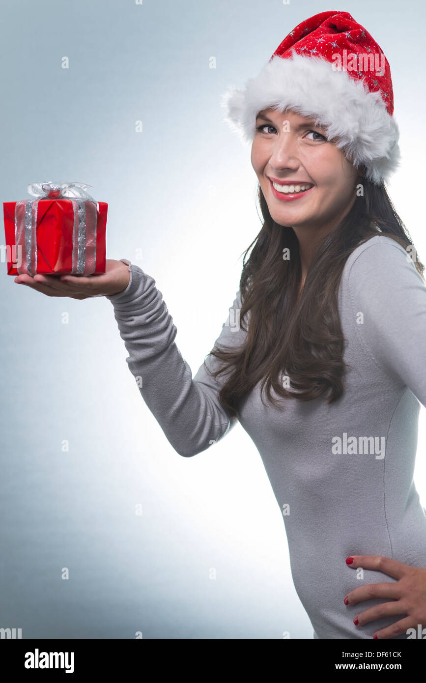 Pretty Young Woman With Long Brunette Hair A Santa Hat And A Lovely