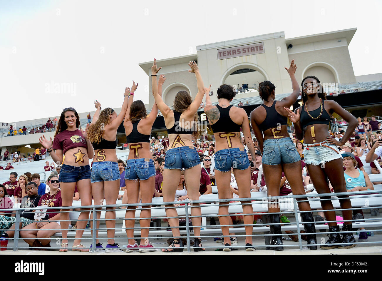 San Marcos, TX, USA. 28th Sep, 2013. Supporters of Texas State University with body tattoo during NCAA football game at Jim Wacker Field in San Marcos, TX. Texas State defeat Wyoming 42-21. © csm/Alamy Live News Stock Photo