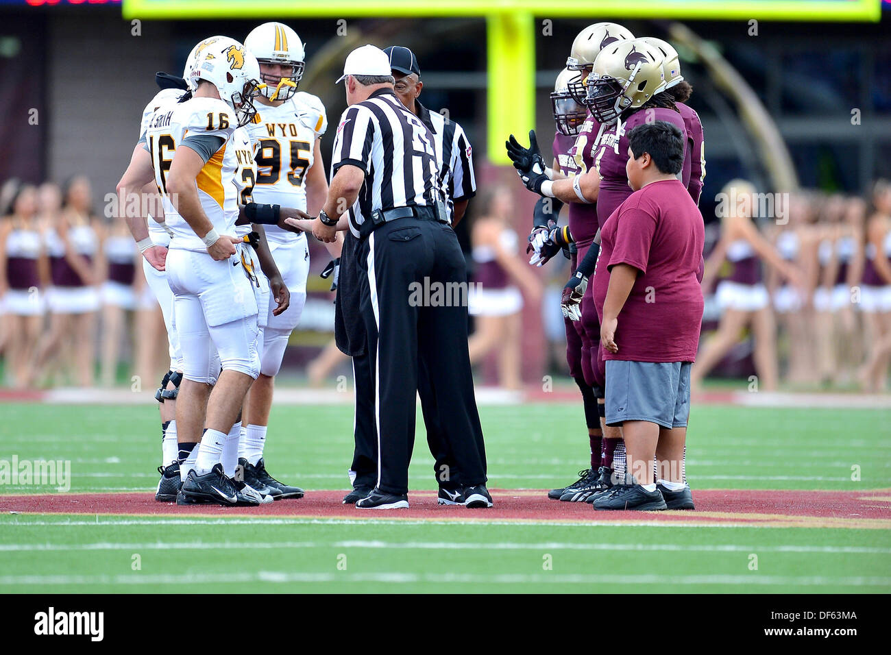 San Marcos, TX, USA. 28th Sep, 2013. Official perform pregame coin toss before NCAA football game kickoff at Jim Wacker Field in San Marcos, TX. Texas State defeat Wyoming 42-21. © csm/Alamy Live News Stock Photo