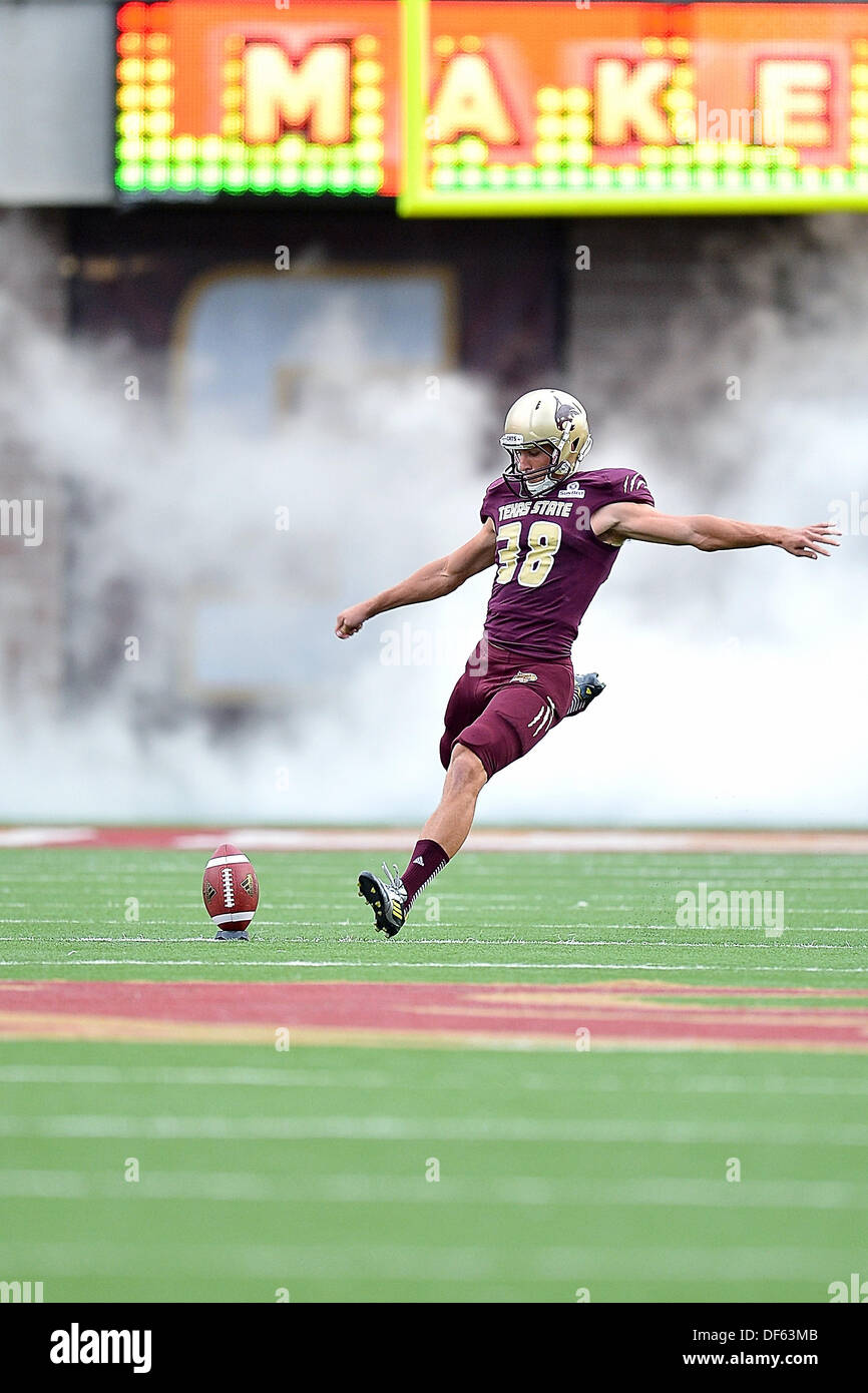 San Marcos, TX, USA. 28th Sep, 2013. Texas State kicker Will Johnson #38 kicks away to start NCAA football game at Jim Wacker Field in San Marcos, TX. Texas State defeat Wyoming 42-21. © csm/Alamy Live News Stock Photo
