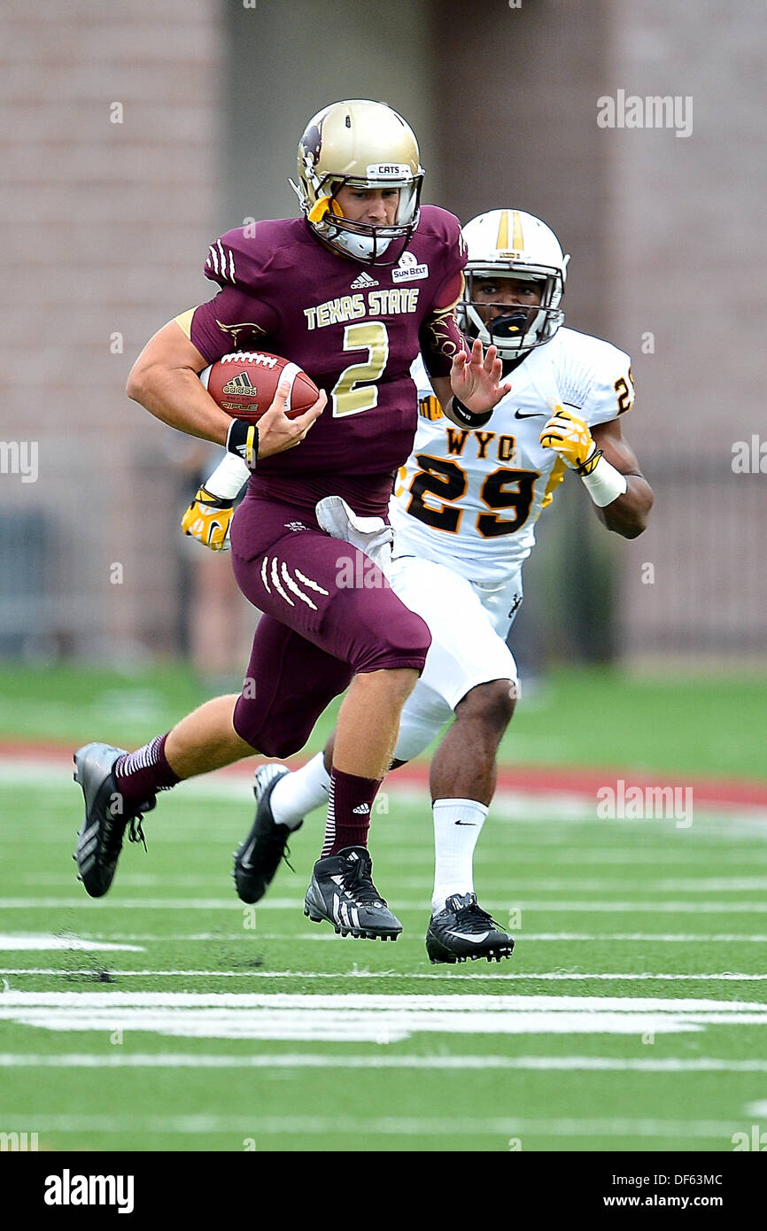San Marcos, TX, USA. 28th Sep, 2013. Texas State wide receiver Montreal Taylor #14 rushes past Wyoming cornerback Tim Hayes #29 during NCAA football game at Jim Wacker Field in San Marcos, TX. Texas State defeat Wyoming 42-21. © csm/Alamy Live News Stock Photo