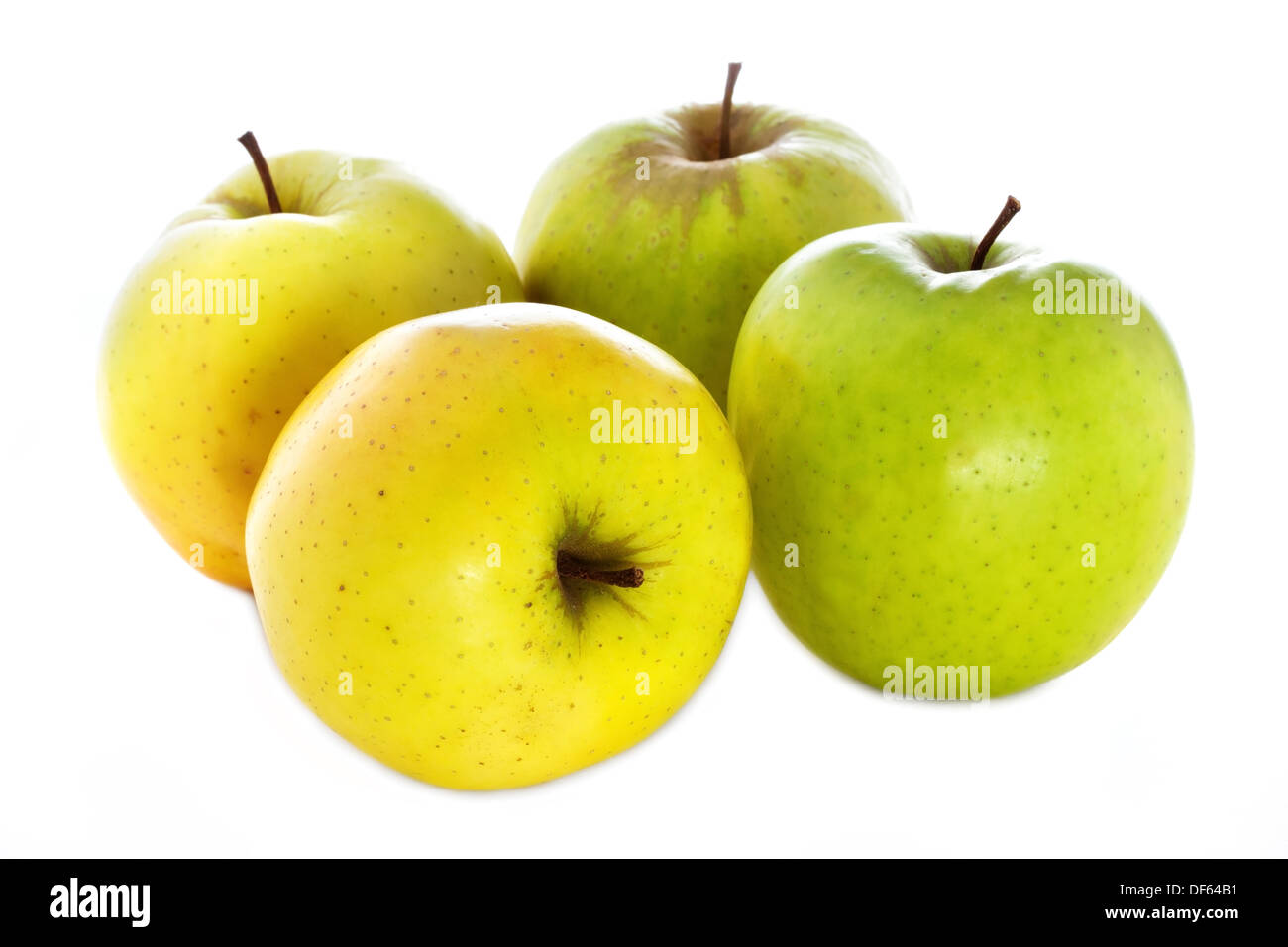 four fresh yellow green apples isolated on a white background Stock Photo