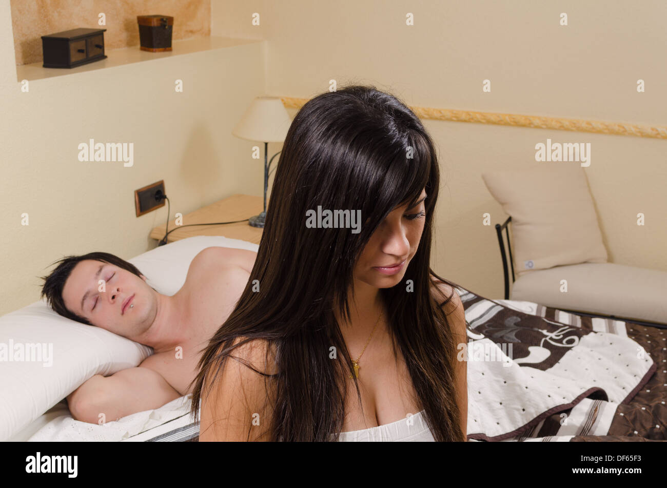 Couple with problems in bed, a conceptual shot Stock Photo