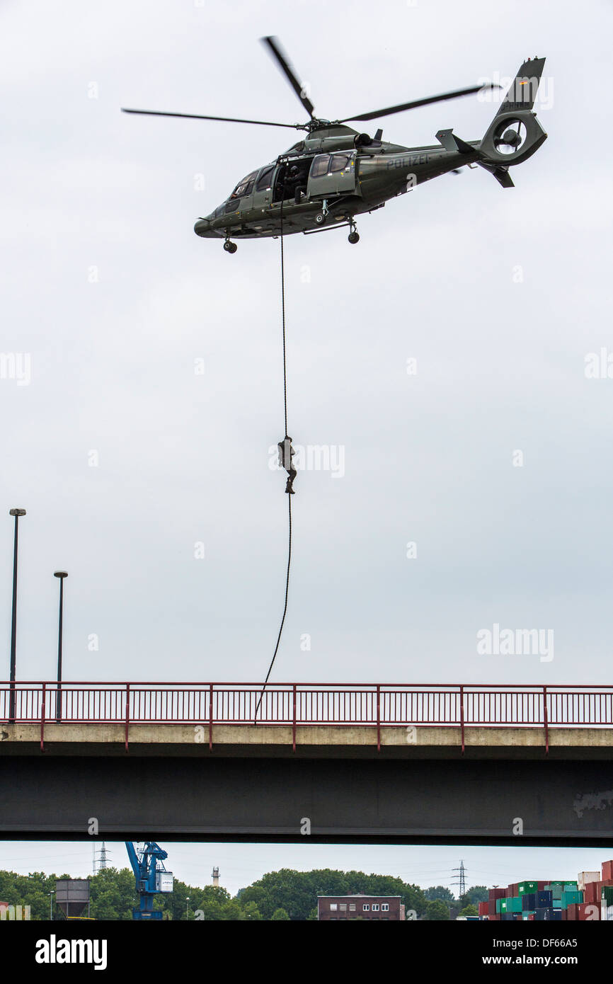 Police SWAT team, fast roping from a helicopter Stock Photo