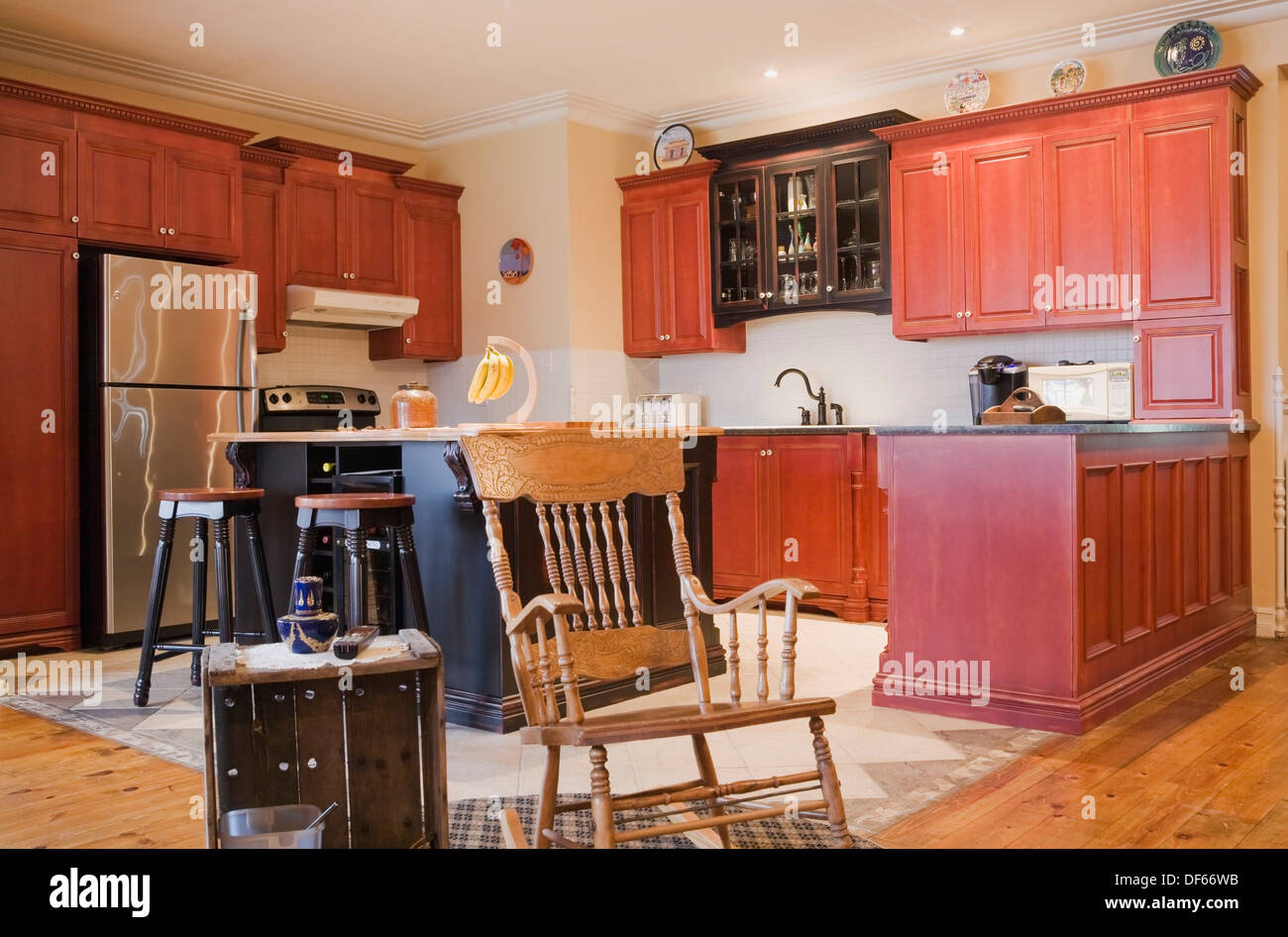 Antique rocking chair and modern furnishings in the kitchen of an Old ...