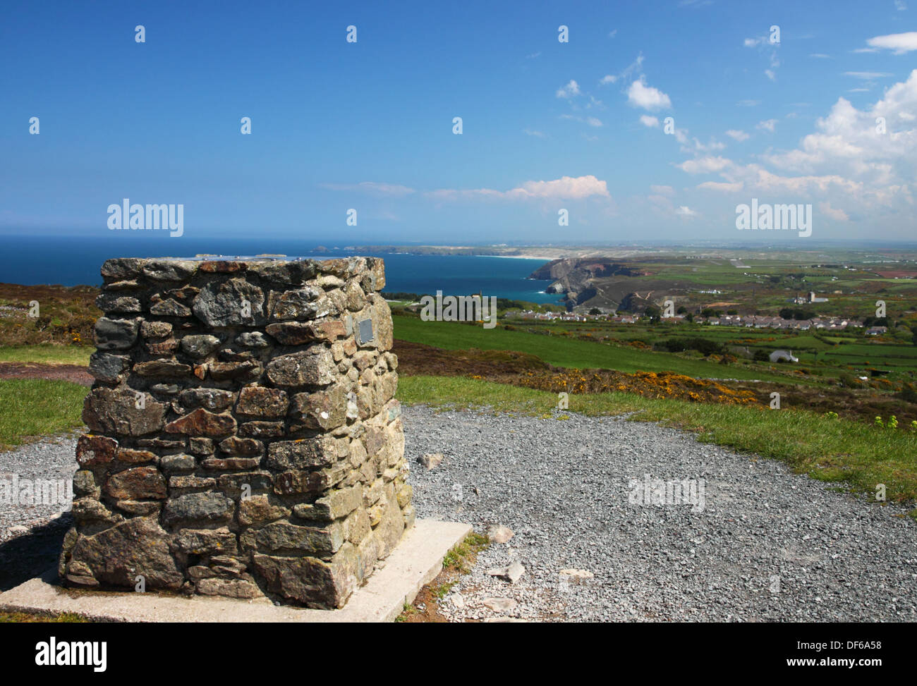 A stone cairn with coastal view in the distance. Stock Photo