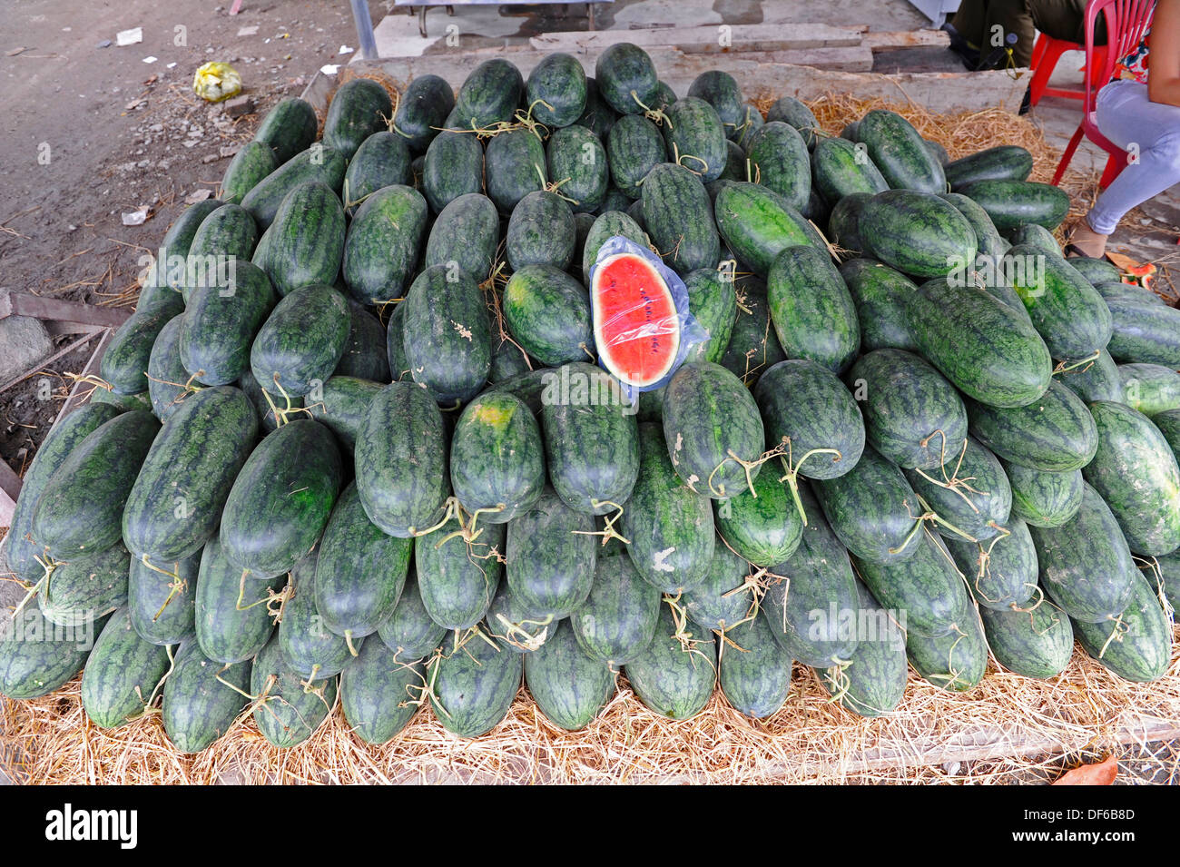 Water melons for sale at Vietnamese outdoor stall. Stock Photo