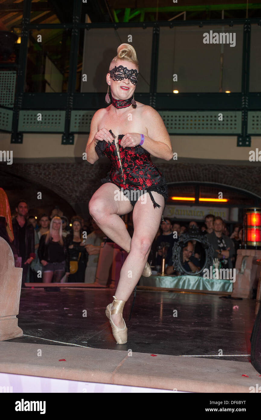 Burlesque artist performing at the pin-up stage at the London Tattoo Convention.  The event attracts over 300 of the most sought after tattoo artists from around the world as well as alternative performers and burlesque acts Stock Photo