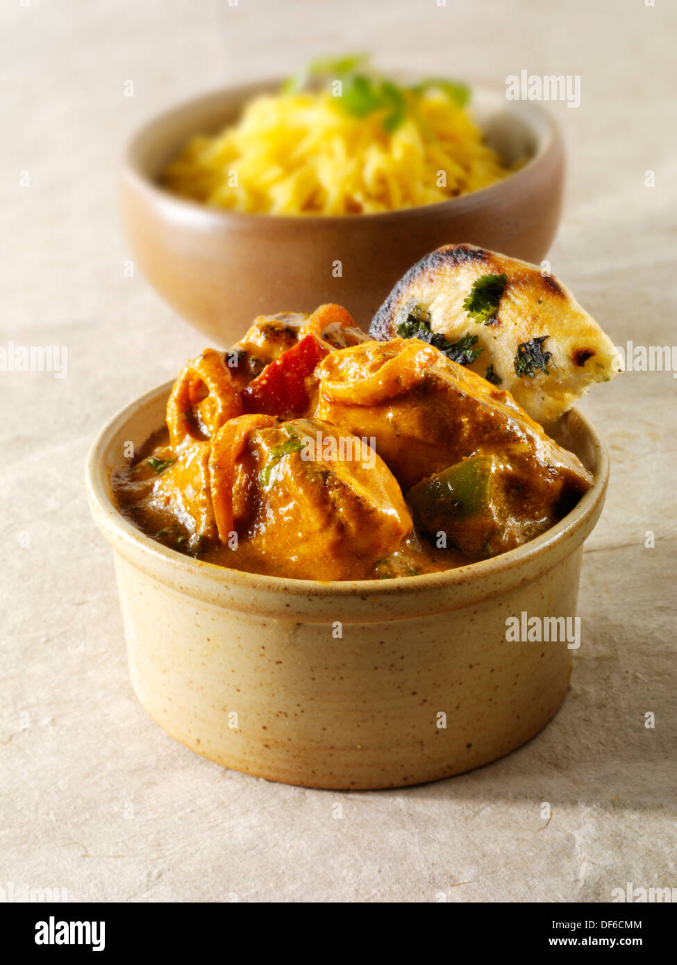 Chicken Jalfrezi, pilau rice & popodoms. Indian traditional curry. Stock Photo