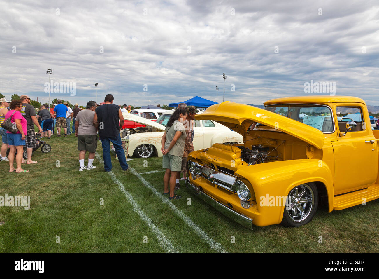 Spectators at the Colorado Classic Car show at Grand Junction, looking at a customised 1956 Ford f100 pickup. USA Stock Photo
