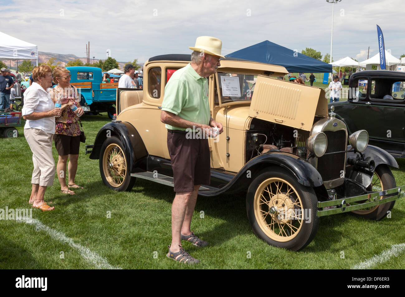 Spectators at the Colorado Classic Car show at Grand Junction, looking at a customised 1929 Ford Model A coupe, USA Stock Photo