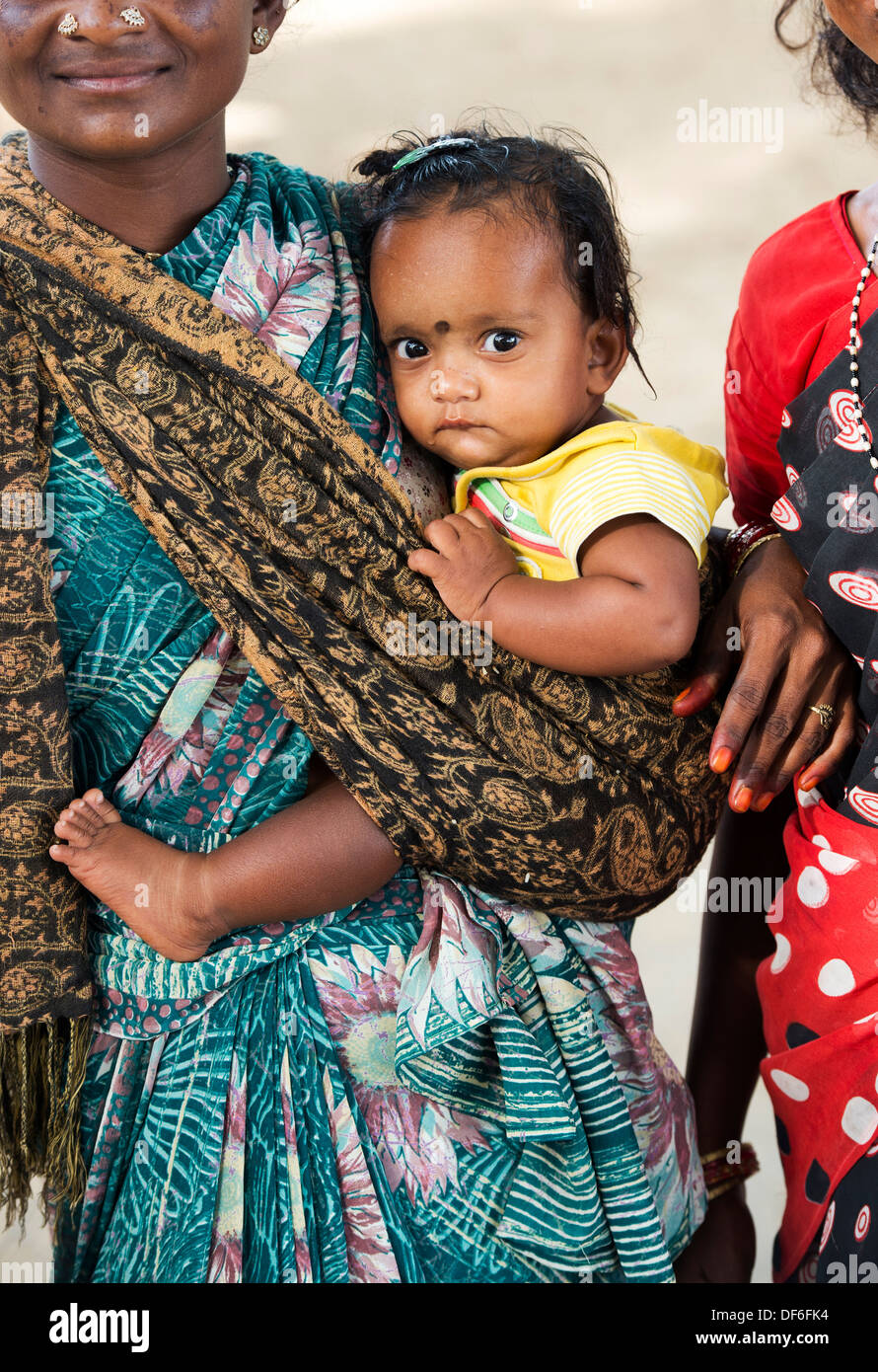 Rural Indian baby in mothers sling. Andhra Pradesh, India Stock Photo