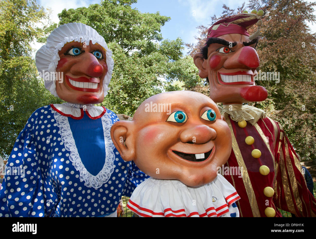 Skipton UK. 29th September, 2013. International Puppet Festival.  Giant scary Punch & Judy Puppets at Skipton's biennial international puppet festival featuring theatre companies from all over Europe with giant puppets animated with hands, feet, toys,  shadows and with a puppet show, punch, performance, theatre stage entertainment, children, traditional, clown, fun, play, judy, red, sign, doll, funny, colourful, event, summer, jester, puppets, sky, wooden giants. Stock Photo