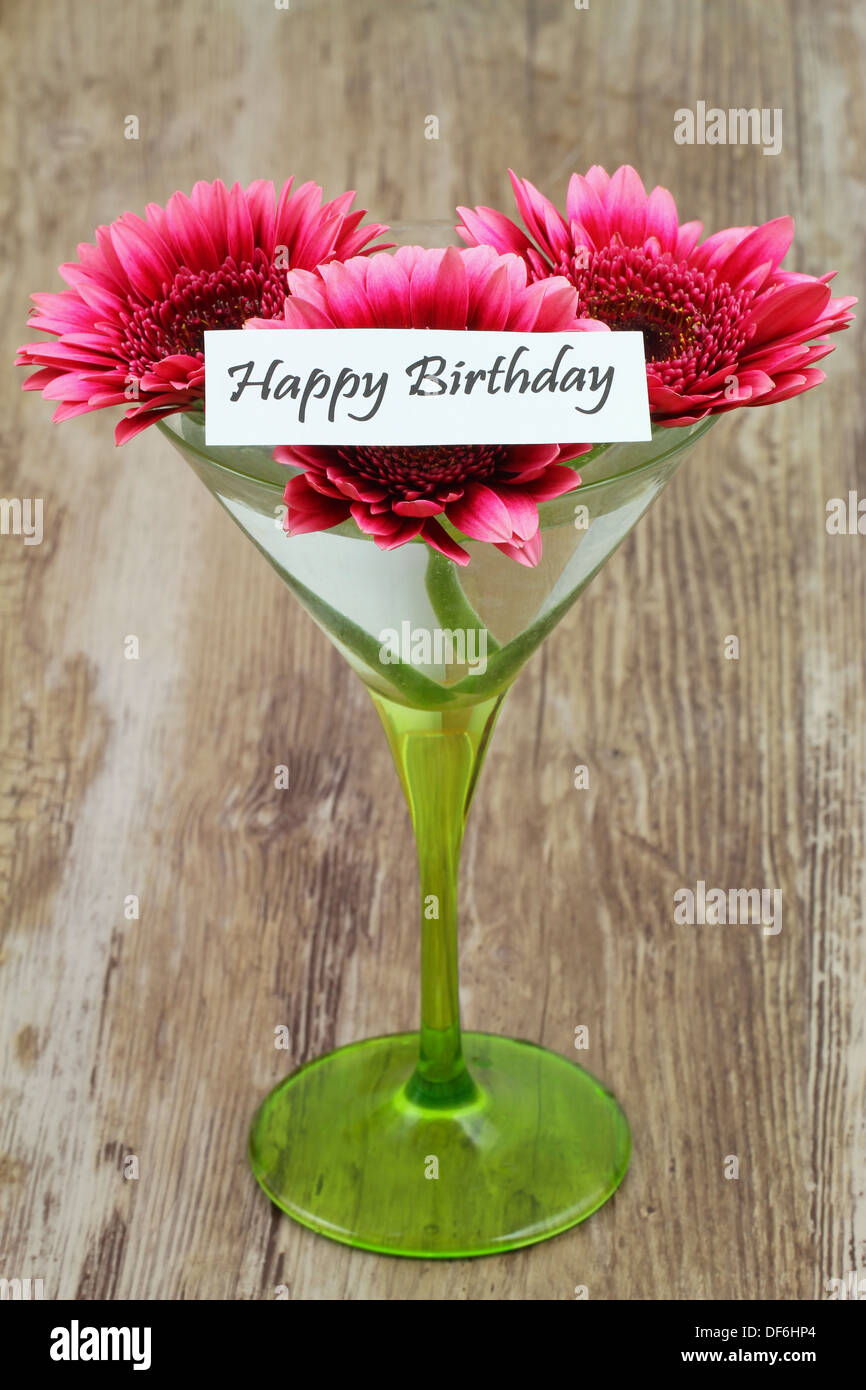 Happy Birthday card with pink gerbera daisies in martini glass Stock Photo
