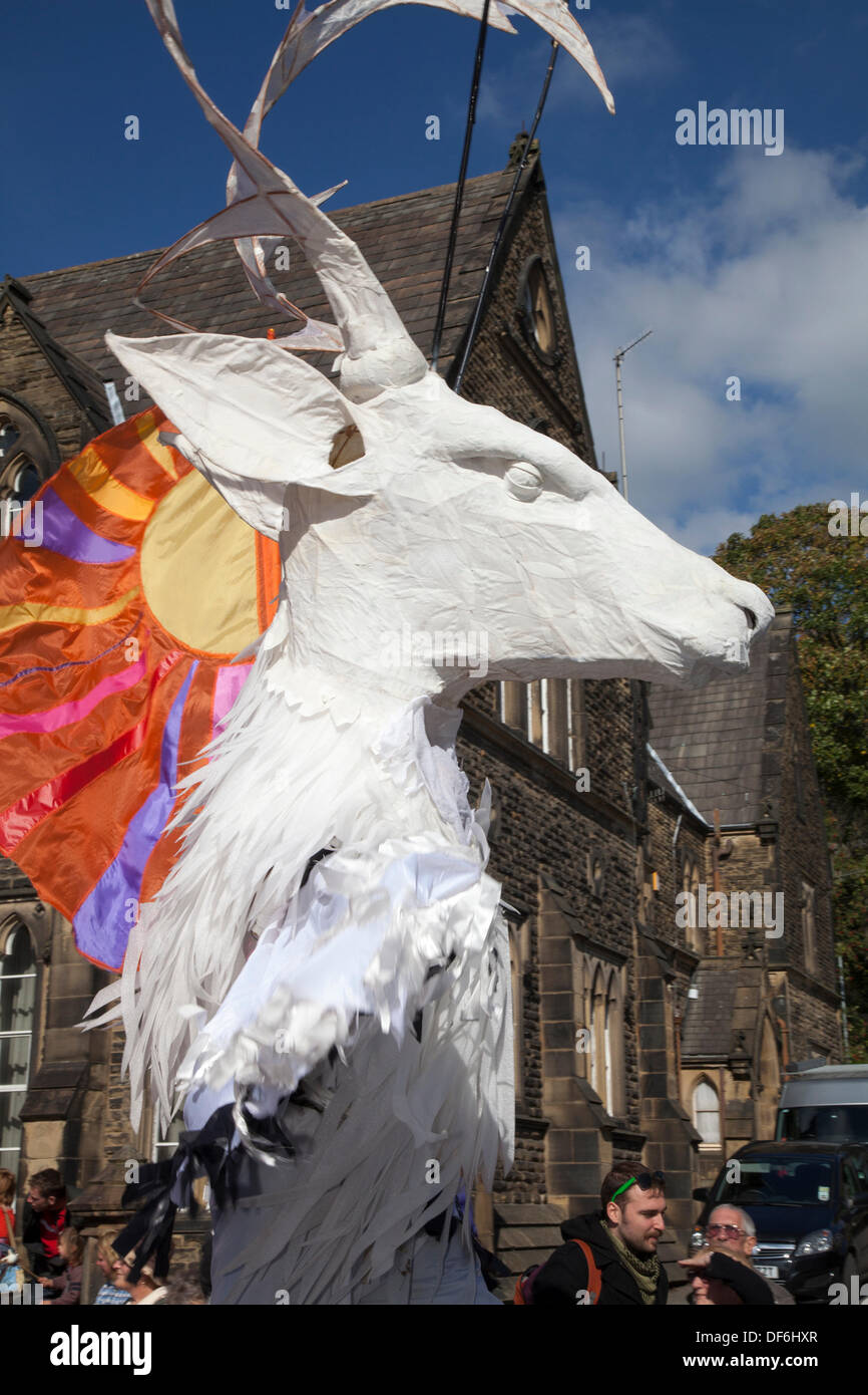 Giant animal puppet caricature masquerade celebration at Skipton UK. 29th September, 2013. International Puppet Festival.  Large Scale Puppetry   Unicorn puppetcraft at Skipton's biennial international puppet festival featuring puppet theatre companies from all over Europe. The events offered 44 ticketed performances plus 32 free street performances.  From giant puppets to puppets so small that they are invisible, the 5th Skipton International Puppet Festival was animated with puppets of a much more traditional character. Stock Photo