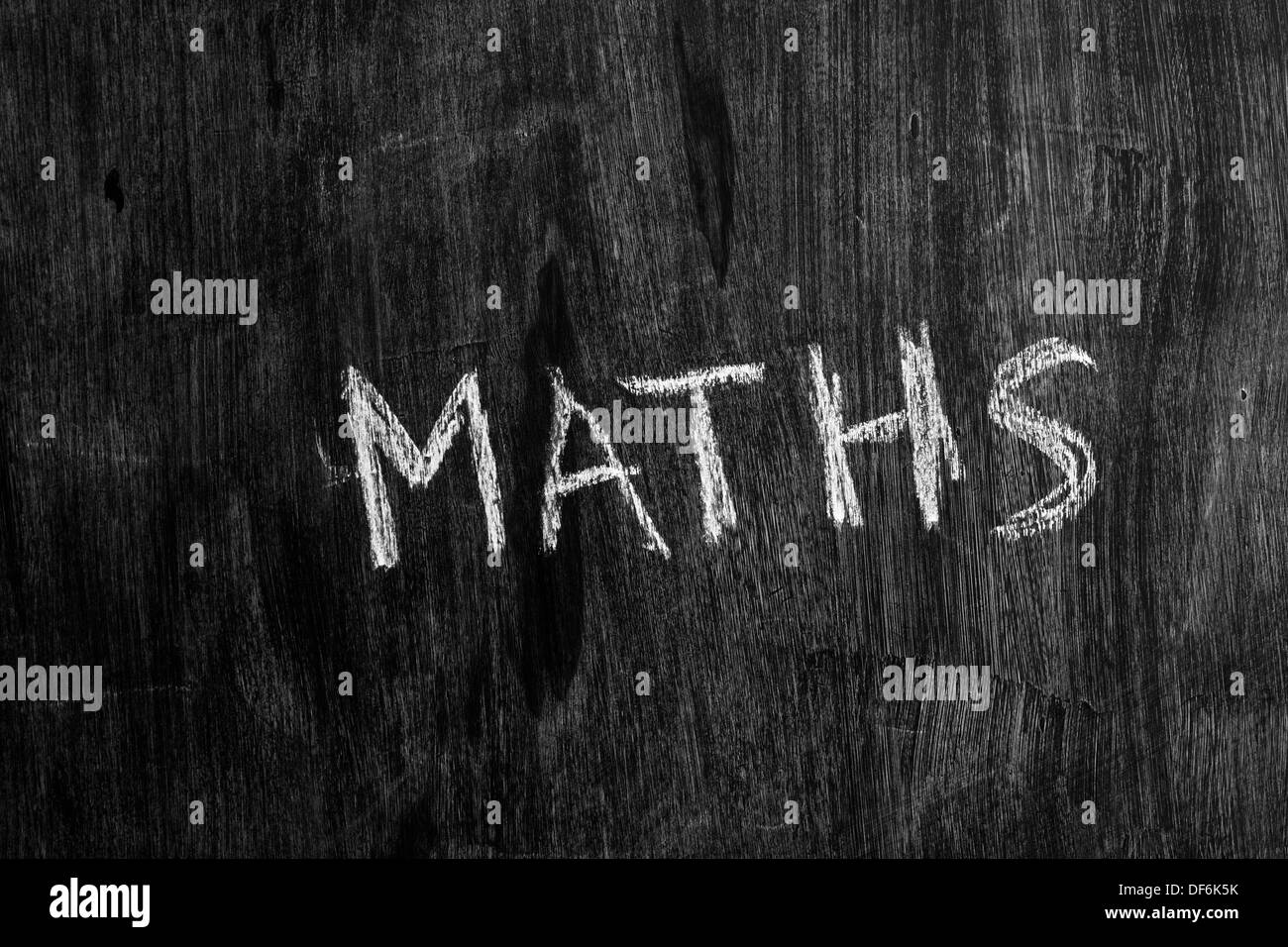 The word maths written in chalk on blackboard Stock Photo