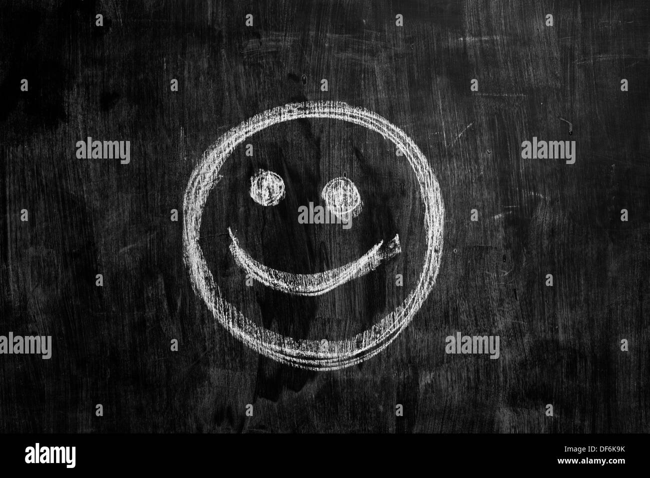 Chalk drawing of smiley face on a blackboard Stock Photo