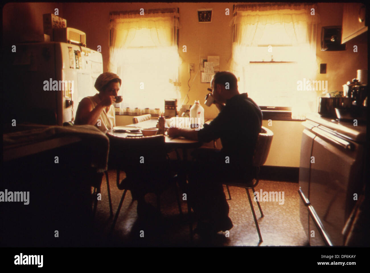 MR. AND MRS. WALLACE A. WOLF EATING BREAKFAST BEFORE HE LEAVES FOR HIS