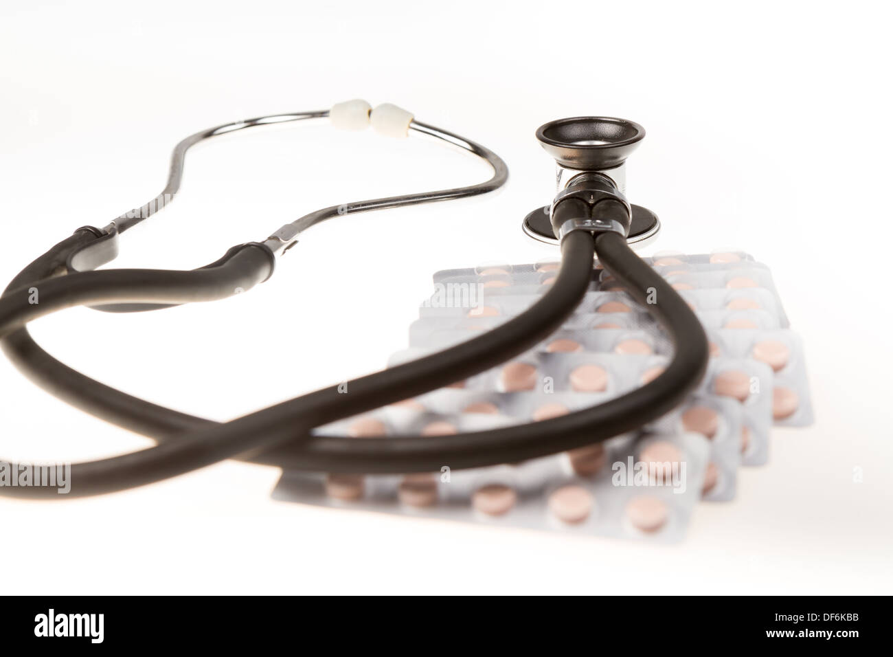 Stethoscope and tablets on isolated white background Stock Photo - Alamy