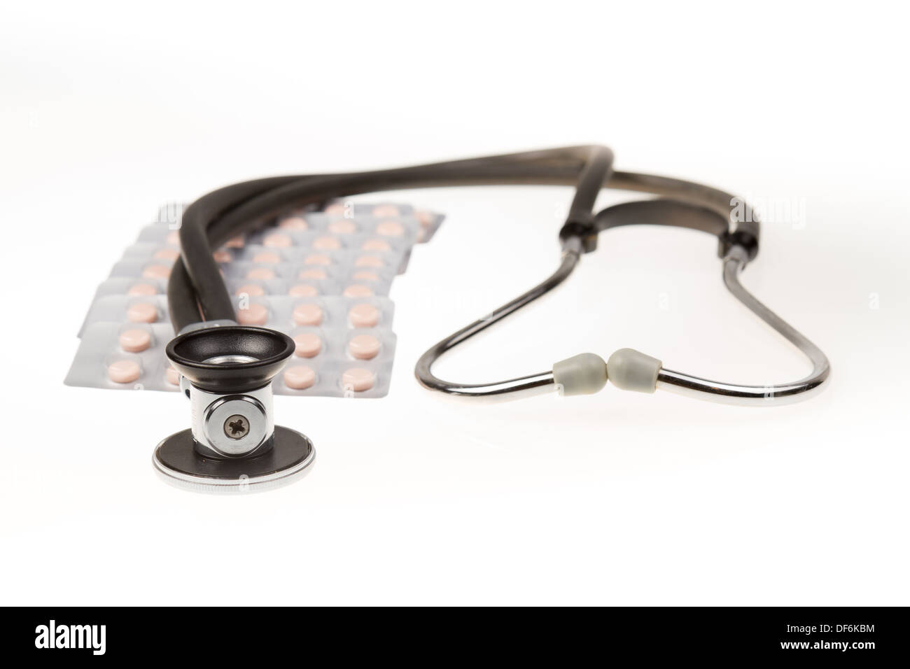 Stethoscope and tablets on isolated white background Stock Photo - Alamy