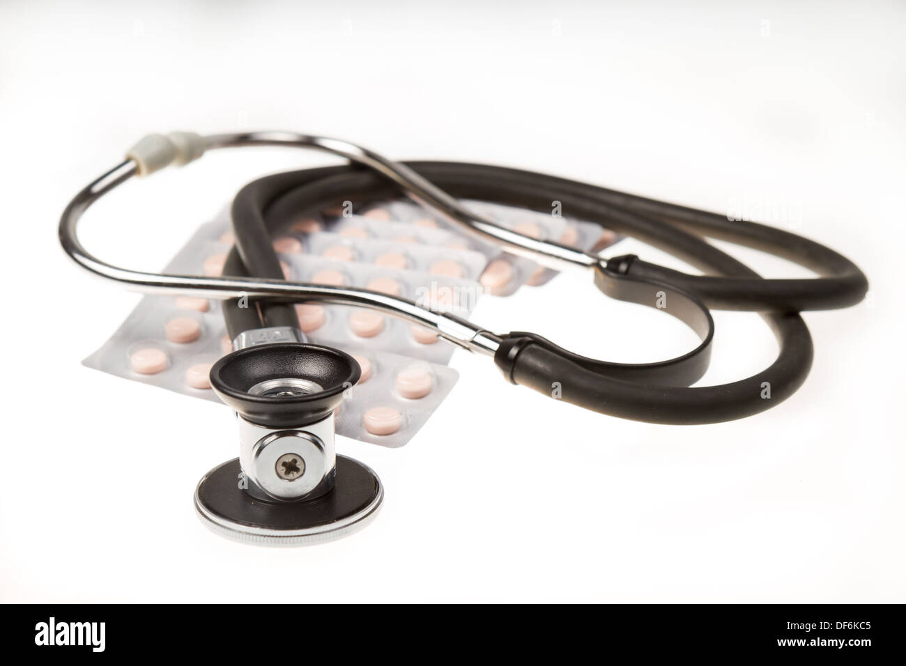 Stethoscope and tablets on isolated white background Stock Photo - Alamy