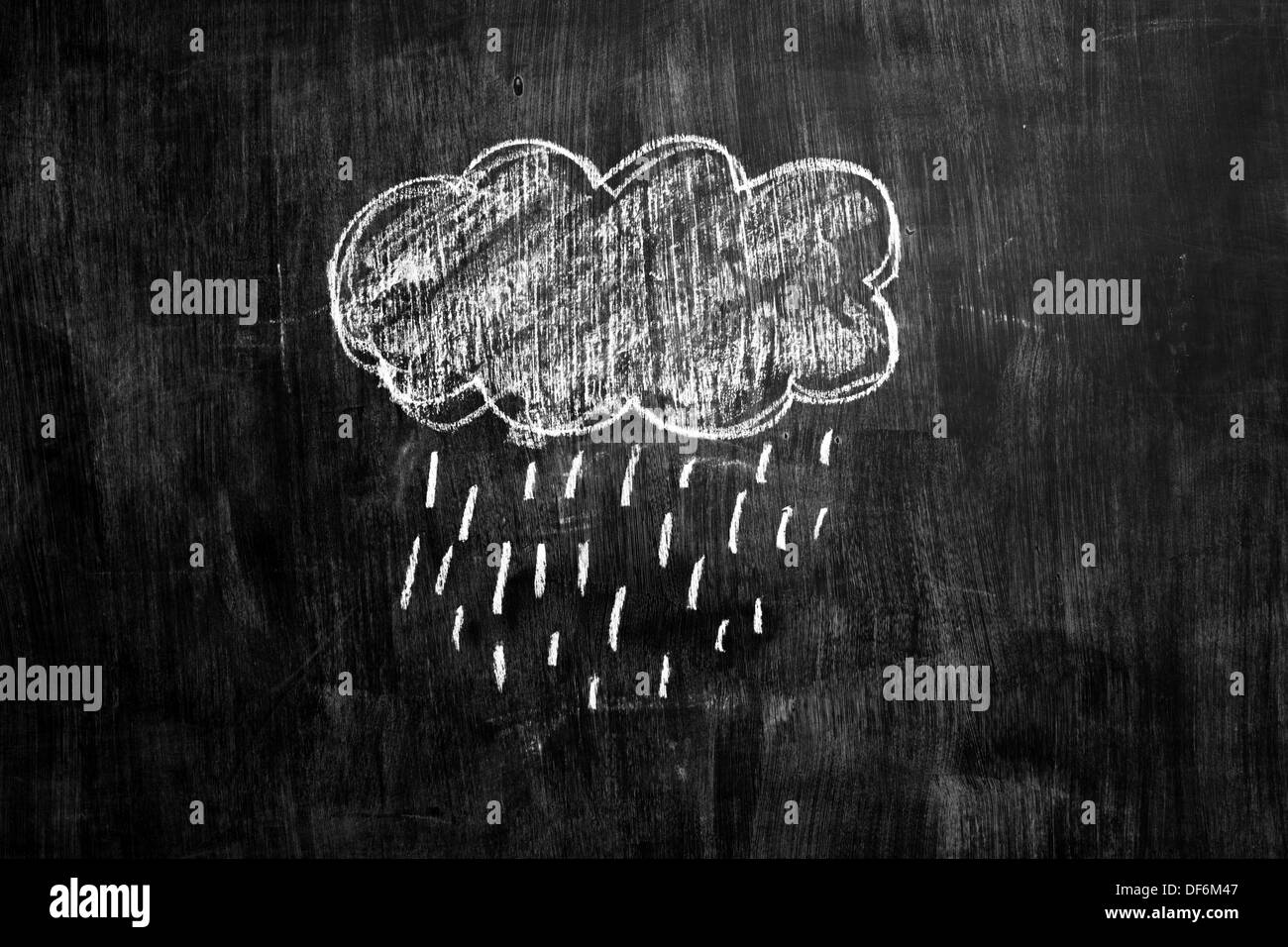 Chalk drawing of rain cloud on blackboard Stock Photo