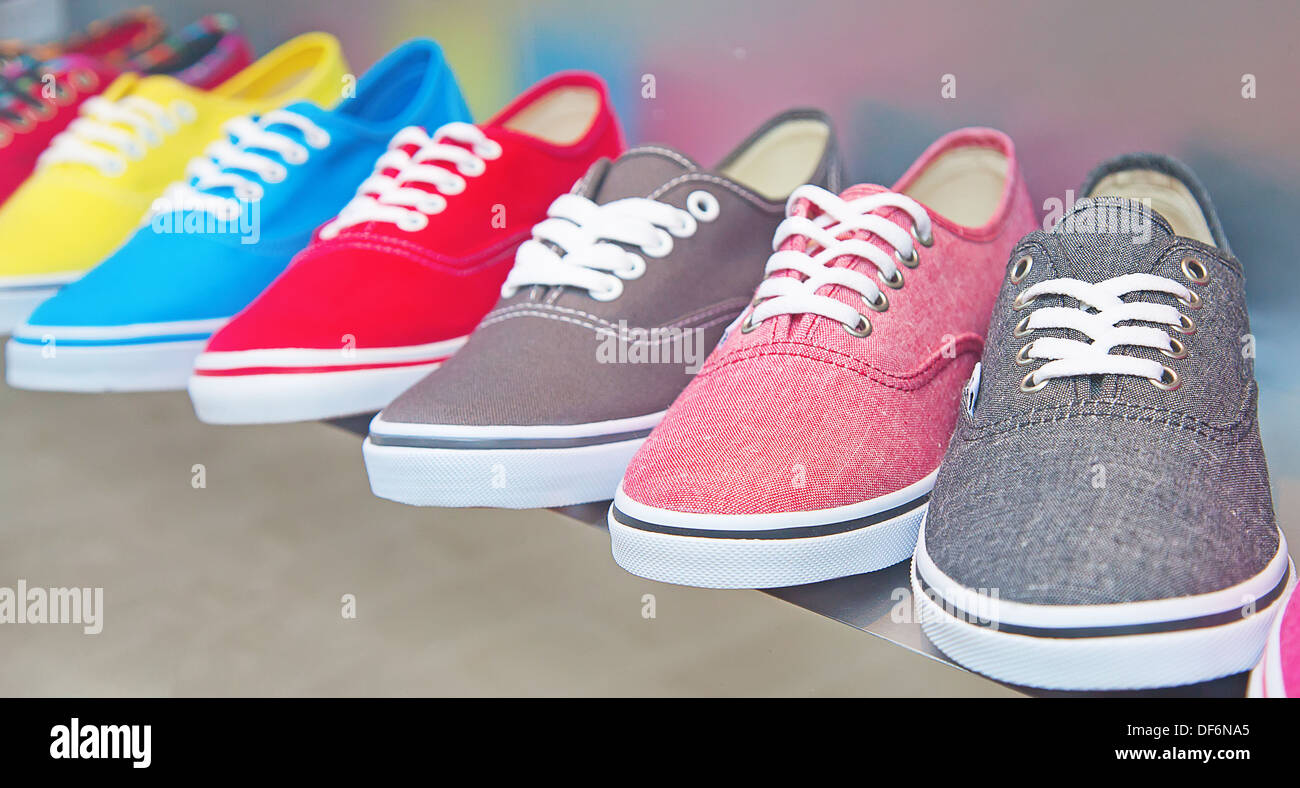 lots of sneaker shoes on sale Stock Photo - Alamy
