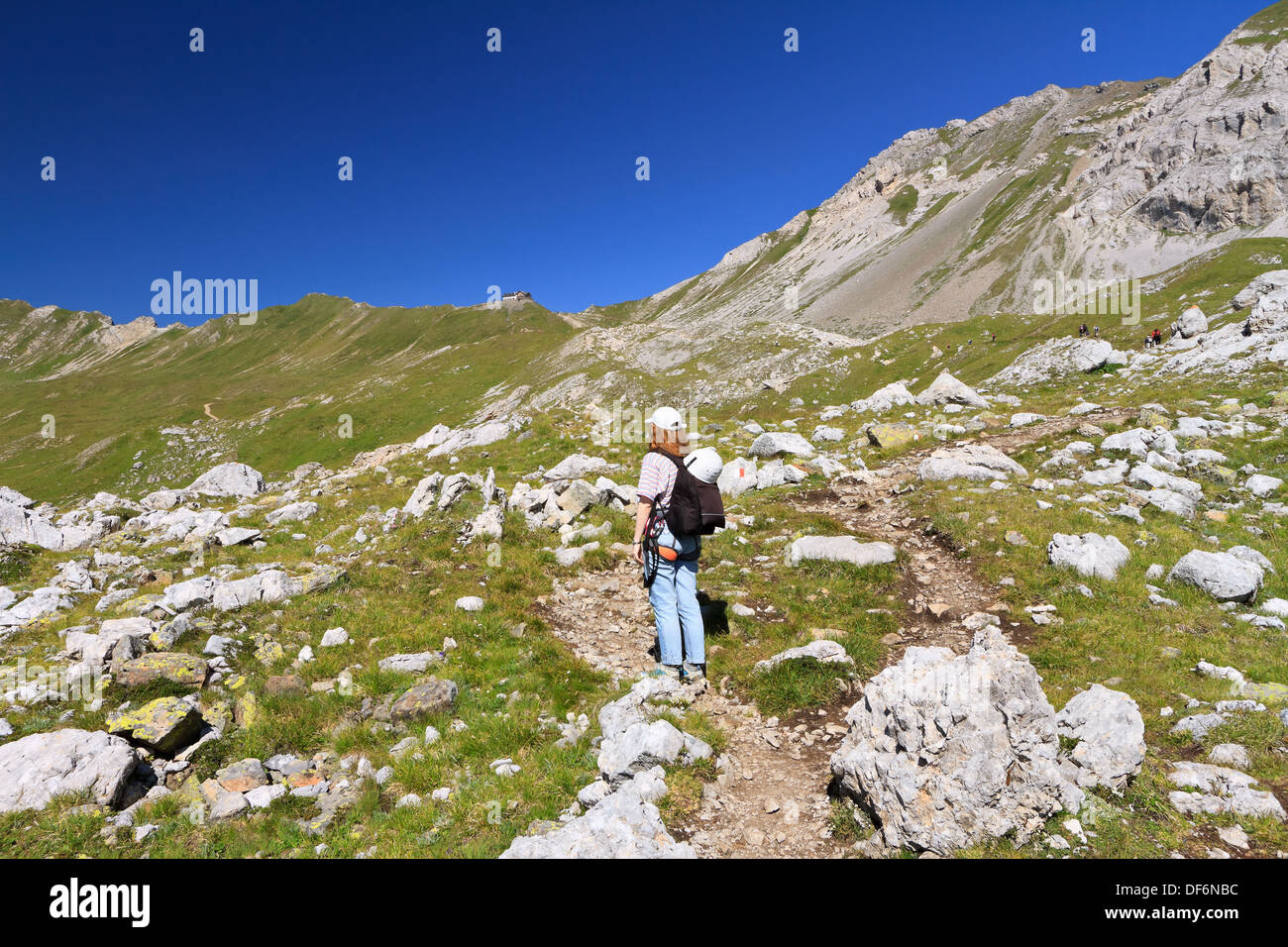 Woman walks on high green hi-res stock photography and images - Alamy