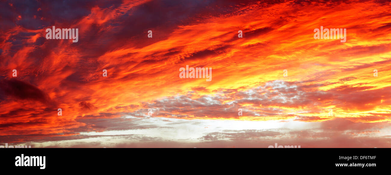 Bright orange sunset clouds in sky Stock Photo