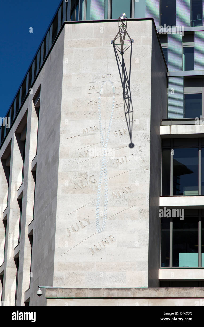 A Noon Mark Sundial on the wall of the London Stock Exchange, Paternoster Square, London, England, UK. Stock Photo