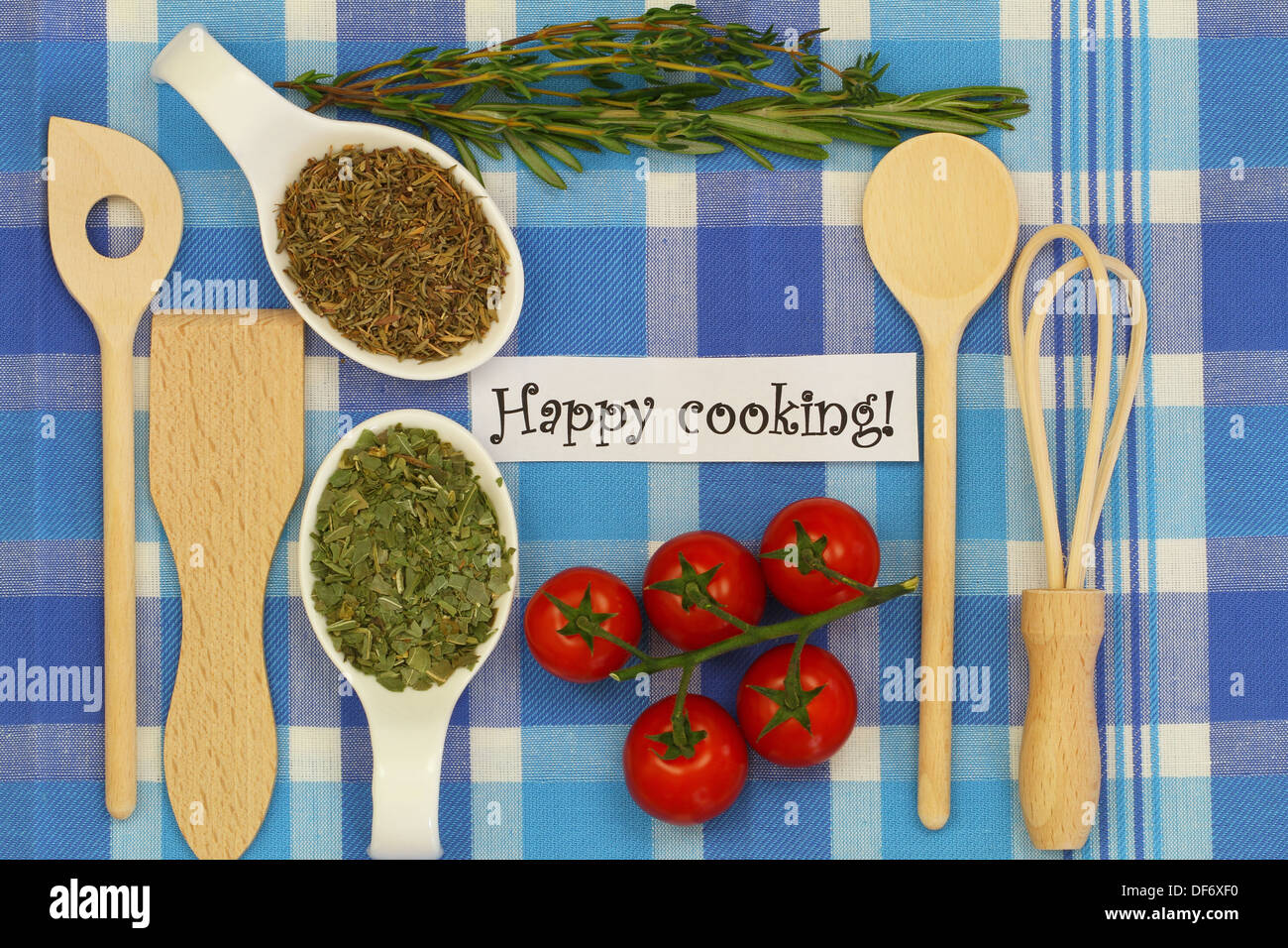 Happy cooking with selection of ingredients on checkered tablecloth Stock Photo