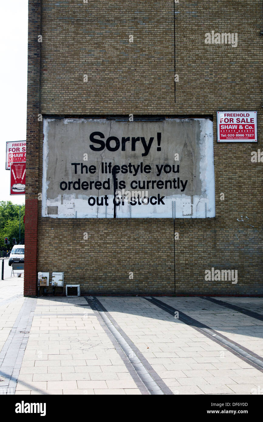 'Sorry the lifestyle that you have ordered is out of stock' street art by Banksy, East India Dock Road, London, UK. Stock Photo