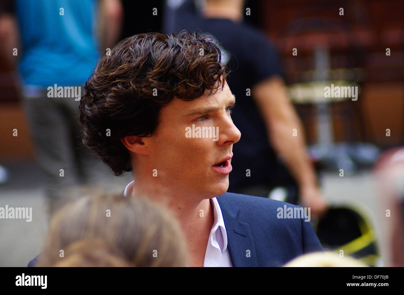 Actor Benedict Cumberbatch taking the time to talk to fans during the filming for BBC Sherlock in North Gower Street, London Stock Photo